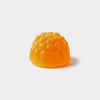 Orange gummy candy on a white background