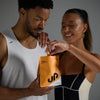 Man and woman holding a supplement package with a brand logo