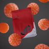Red and white supplement package with orange gummies on a dark background