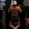 Person doing pull-ups inside a gym 